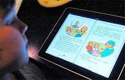 Photo of Child Reading eBook on iPad